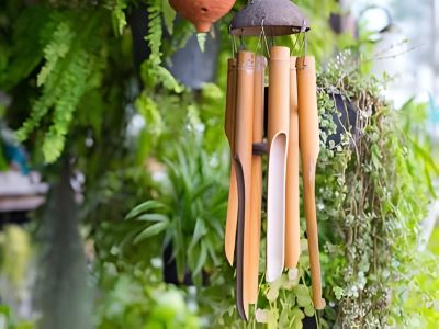 close up on a wooden wind chime to keep birds of your porch